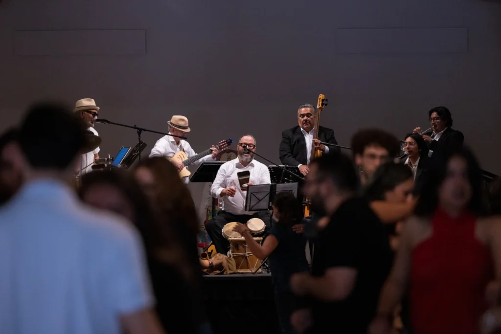A live band performing at a UCR Arts community dance event