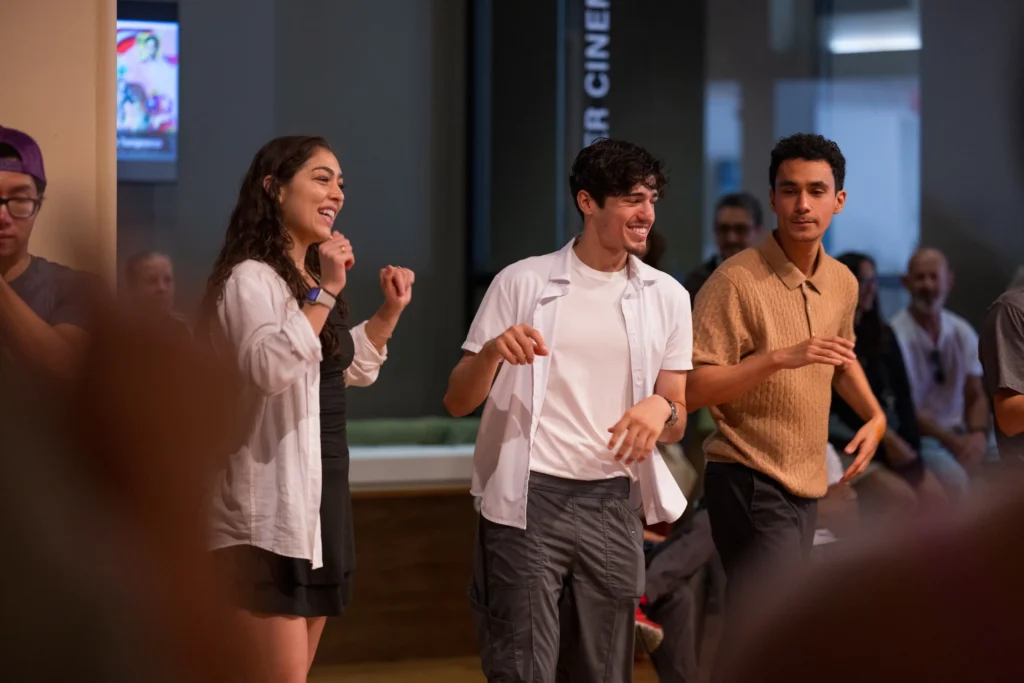 A dancer smiling at a UCR Arts community event