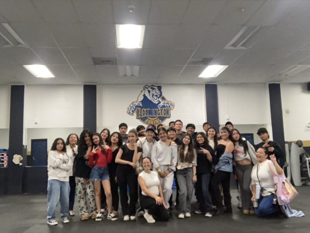 Cinthia Durán with high-school students at a Newcomer Day movement workshop, Bloomington High School