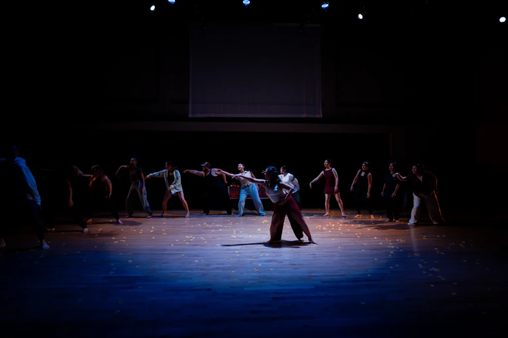 Ritwal — a centre-stage duet in front of the ensemble, UC Riverside Department of Dance, Spring Forward 2023